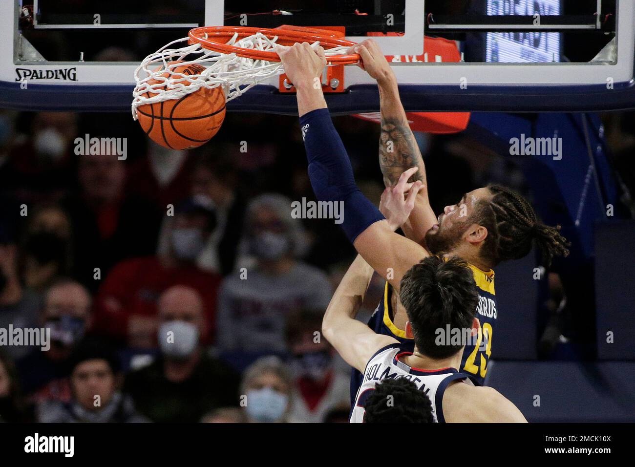 Northern Arizona center Ezekiel Richards, top, dunks next to Gonzaga