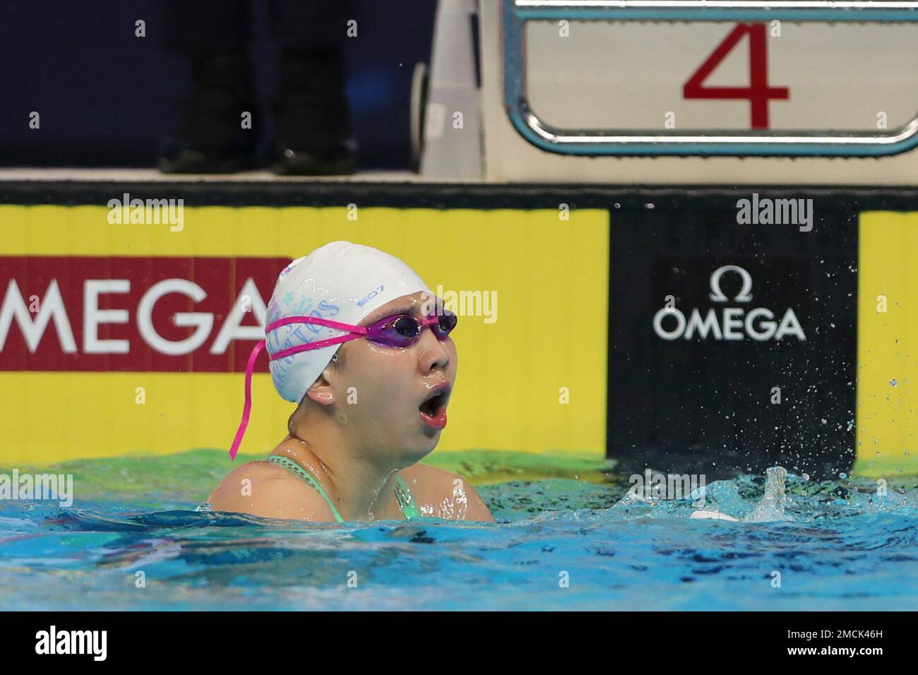 China's Qianting Tang reacts after winning the 100 meters breaststroke