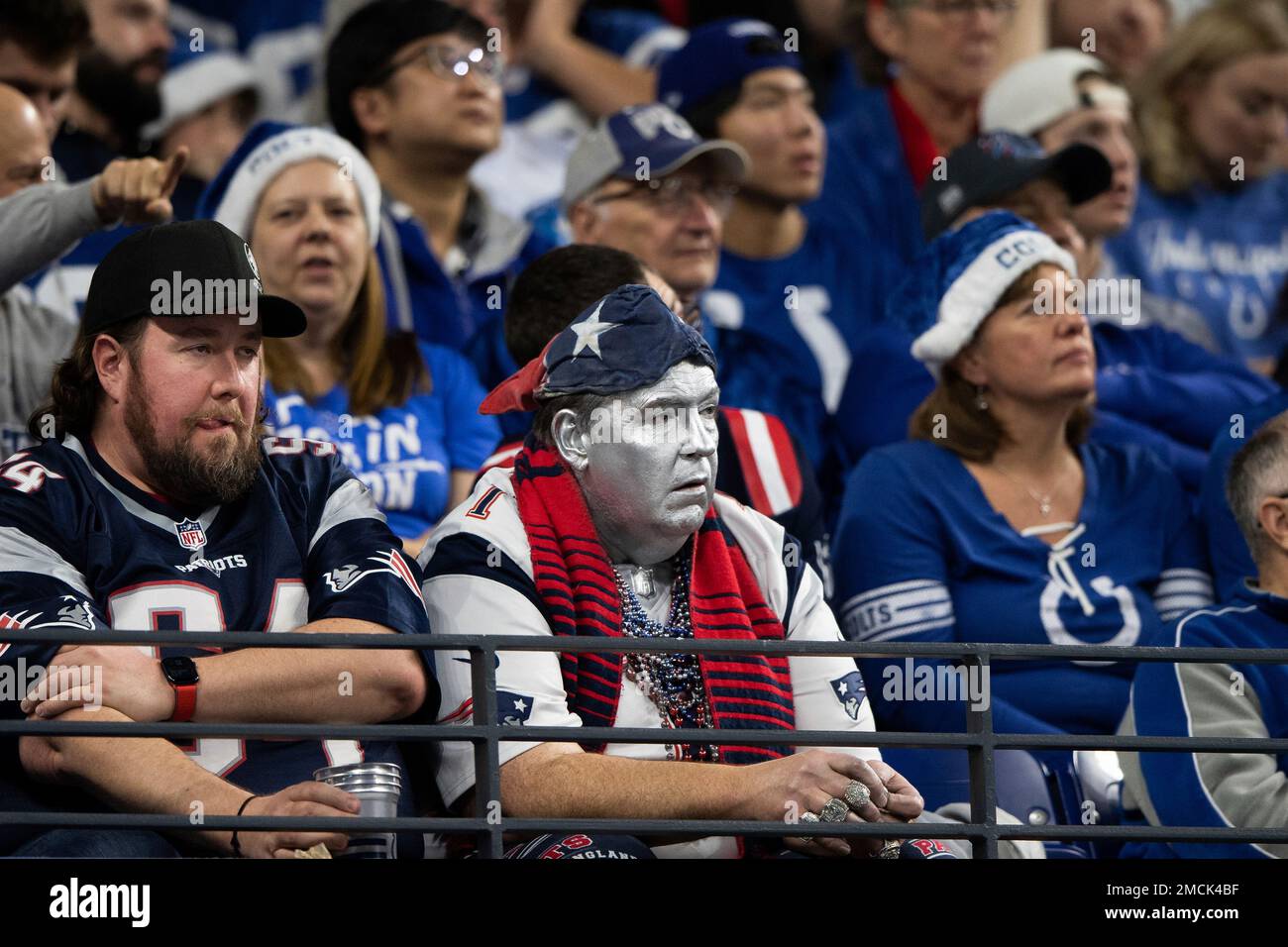 A New England Patriots fan with his face painted sits in the stands during an NFL football game against the Indianapolis Colts, Saturday, Dec. 18, 2021, in Indianapolis. (AP Photo/Zach Bolinger Stock