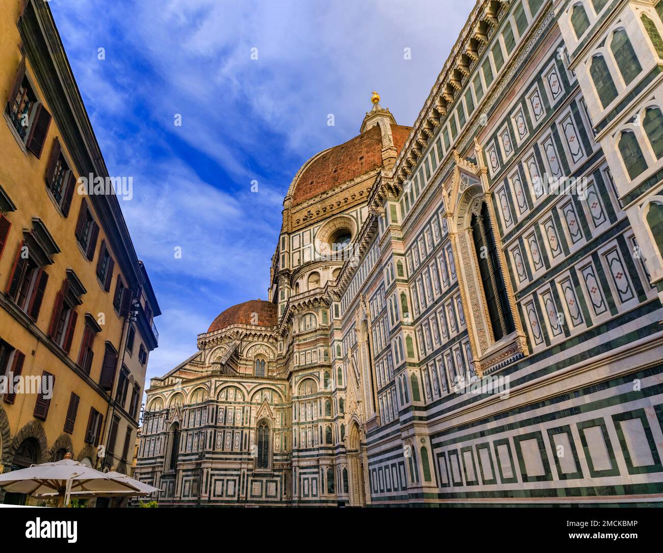 Ornate colorful marble facade of the Duomo Cathedral or Cattedrale di Santa Maria del Fiore, Florence, Italy known for the red tiled Brunelleschi dome Stock Photo