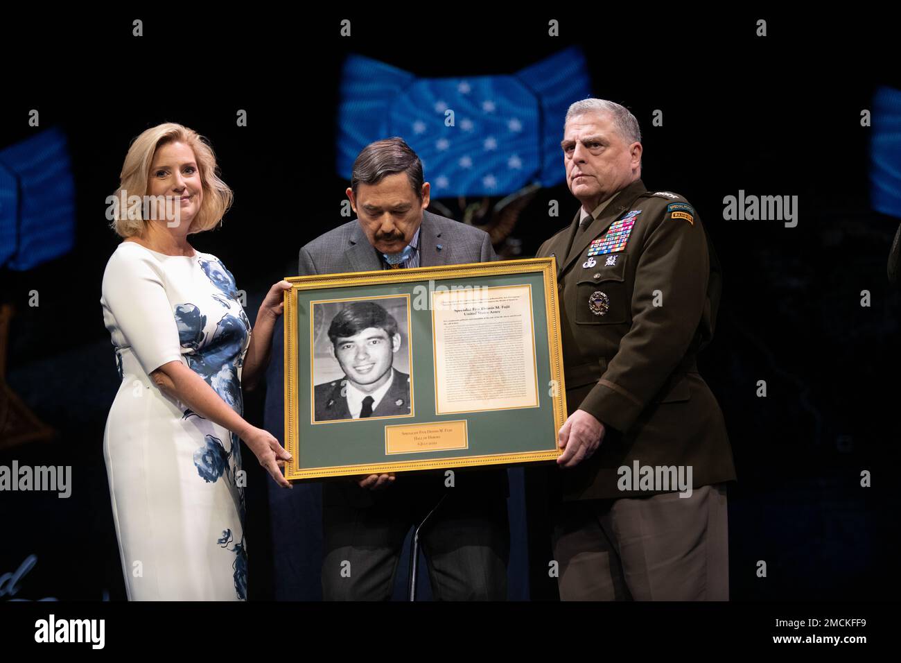 Secretary of the Army Christine Wormuth presents a photo and citation to Medal of Honor recipient former Army Spc. Five Dennis M. Fujii, in a ceremony in which Fujii and five other Medal of Honor recipients were inducted into the Pentagon Hall of Heroes, at Joint Base Myer-Henderson Hall, Va., July 6, 2022. (DoD photo by Lisa Ferdinando) Stock Photo