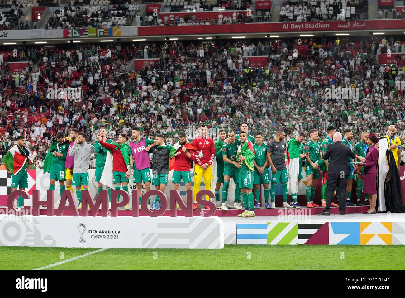 Algeria's players celebrate after winning the Arab Cup final soccer