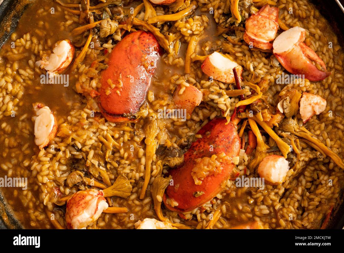 Original spanish paella recipe with lobster and vegetables Stock Photo