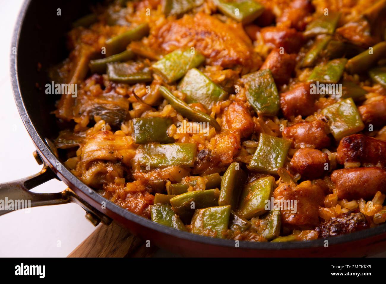Original spanish paella recipe with sausage pork and vegetables Stock