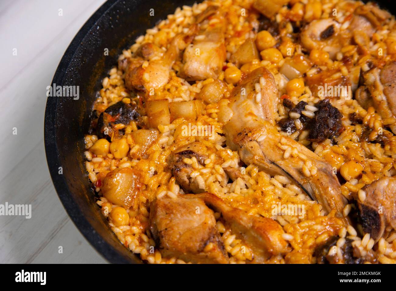 Original spanish paella recipe with rabbit, pork and vegetables Stock