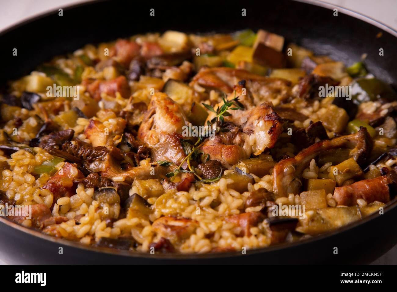 Original spanish paella recipe with rabbit, pork and vegetables Stock