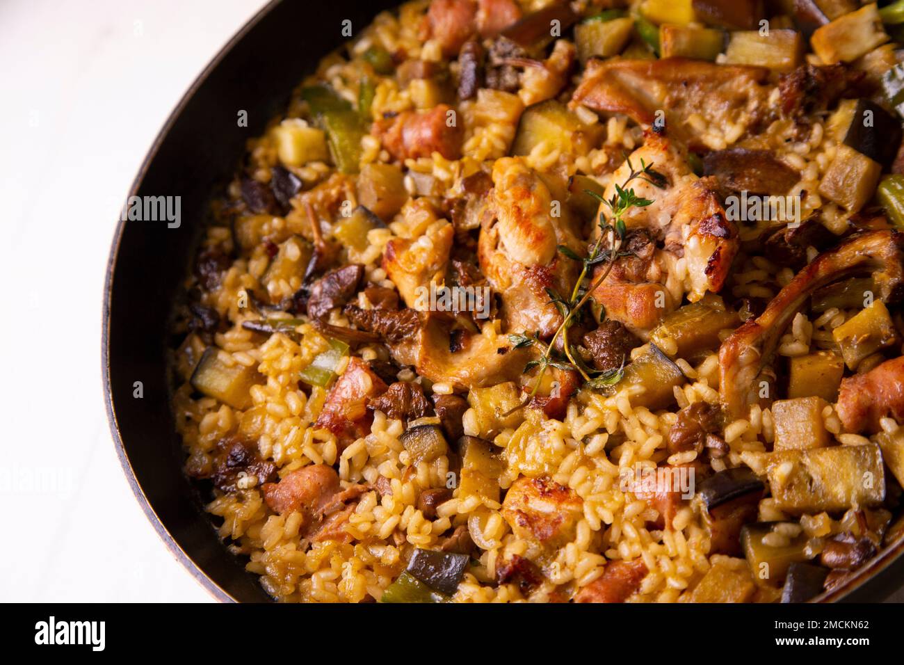Original spanish paella recipe with rabbit, pork and vegetables Stock