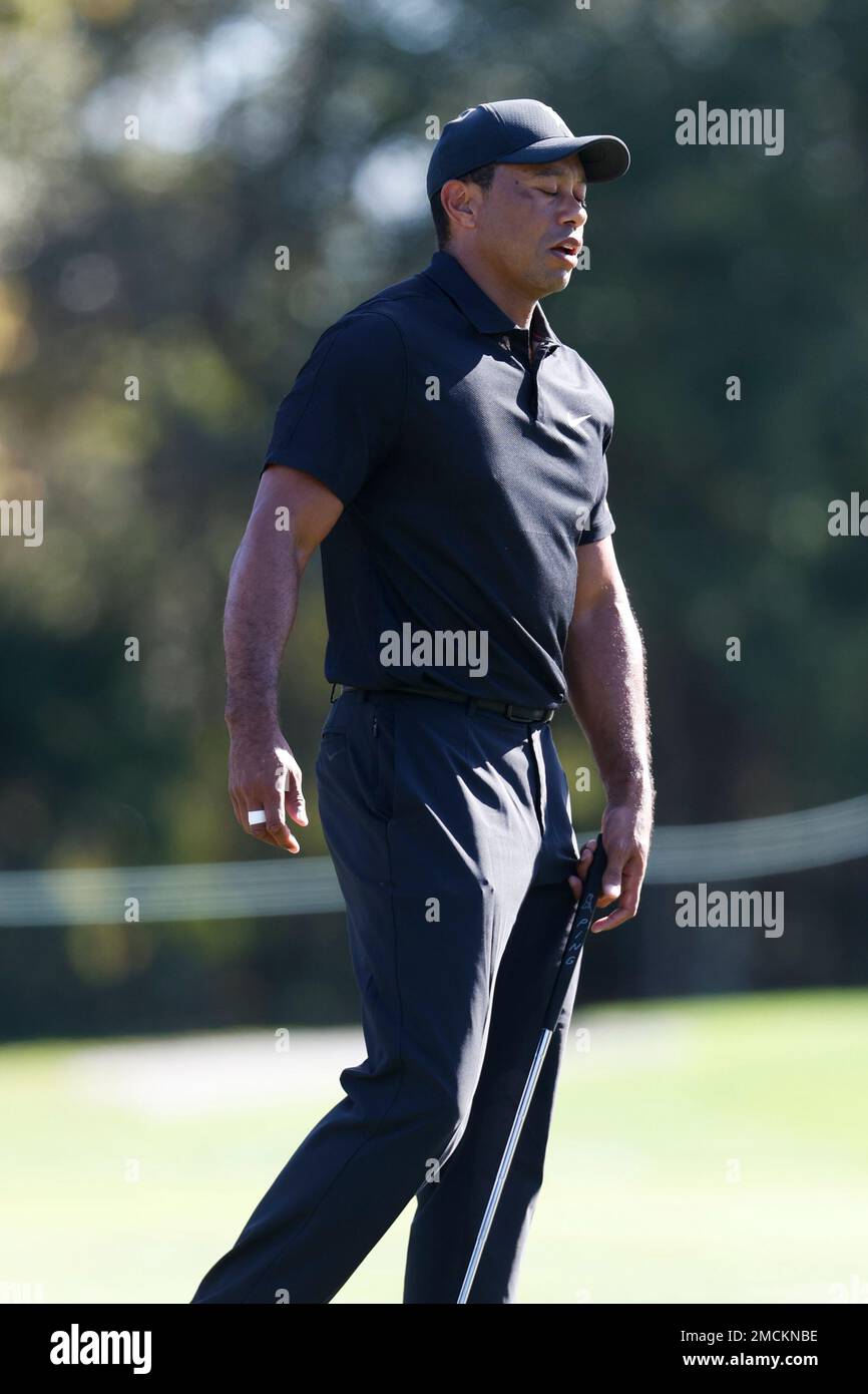 Tiger Woods reacts to missing a putt during the first round of the PNC Championship golf tournament Friday, Dec