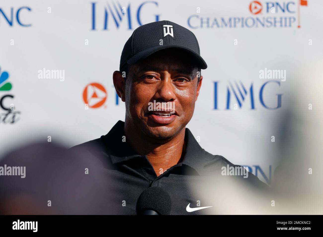 Tiger Woods speaks during a press conference following during the first round of the PNC Championship golf tournament Friday, Dec