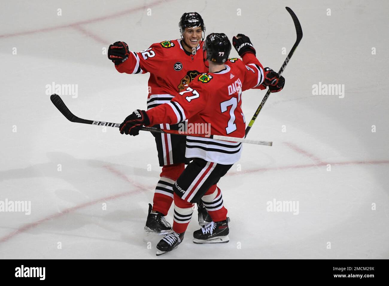 Chicago Blackhawks center Kirby Dach (77) and Colorado Avalanche