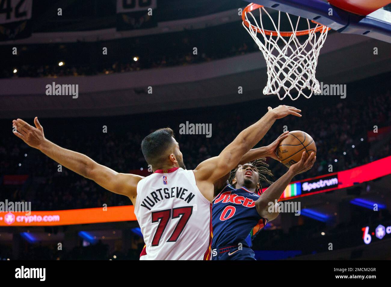 Miami Heat's Omer Yurtseven, right, get the rebound ahead of