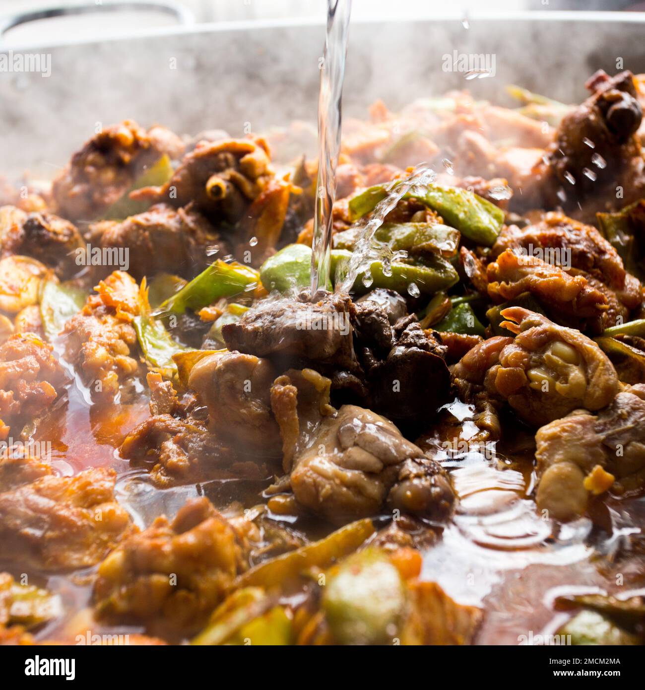 Paella Valenciana with vegetables, chicken and wild rabbit. Authentic