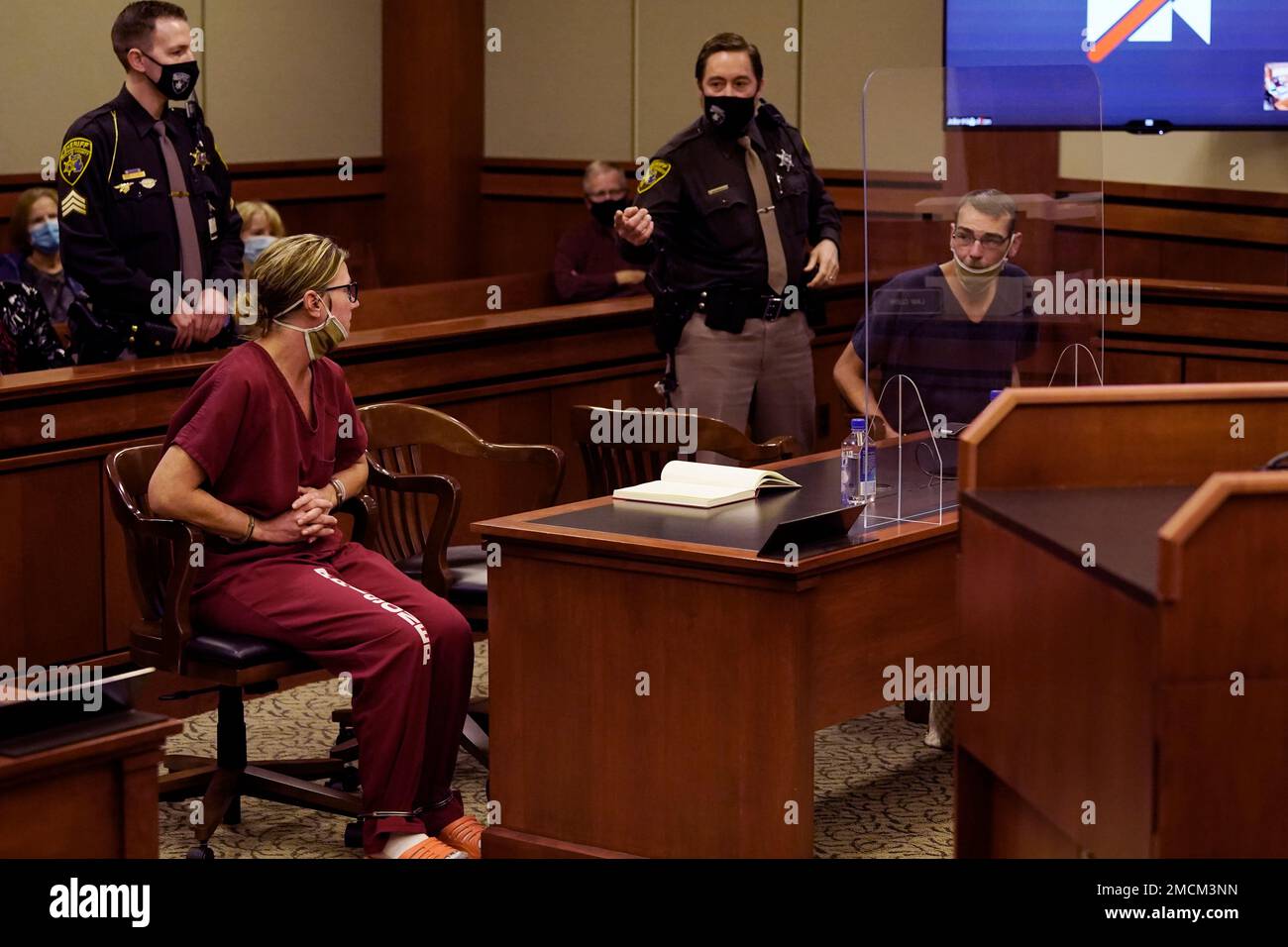 James Crumbley, right, looks towards his wife Jennifer Crumbley during ...