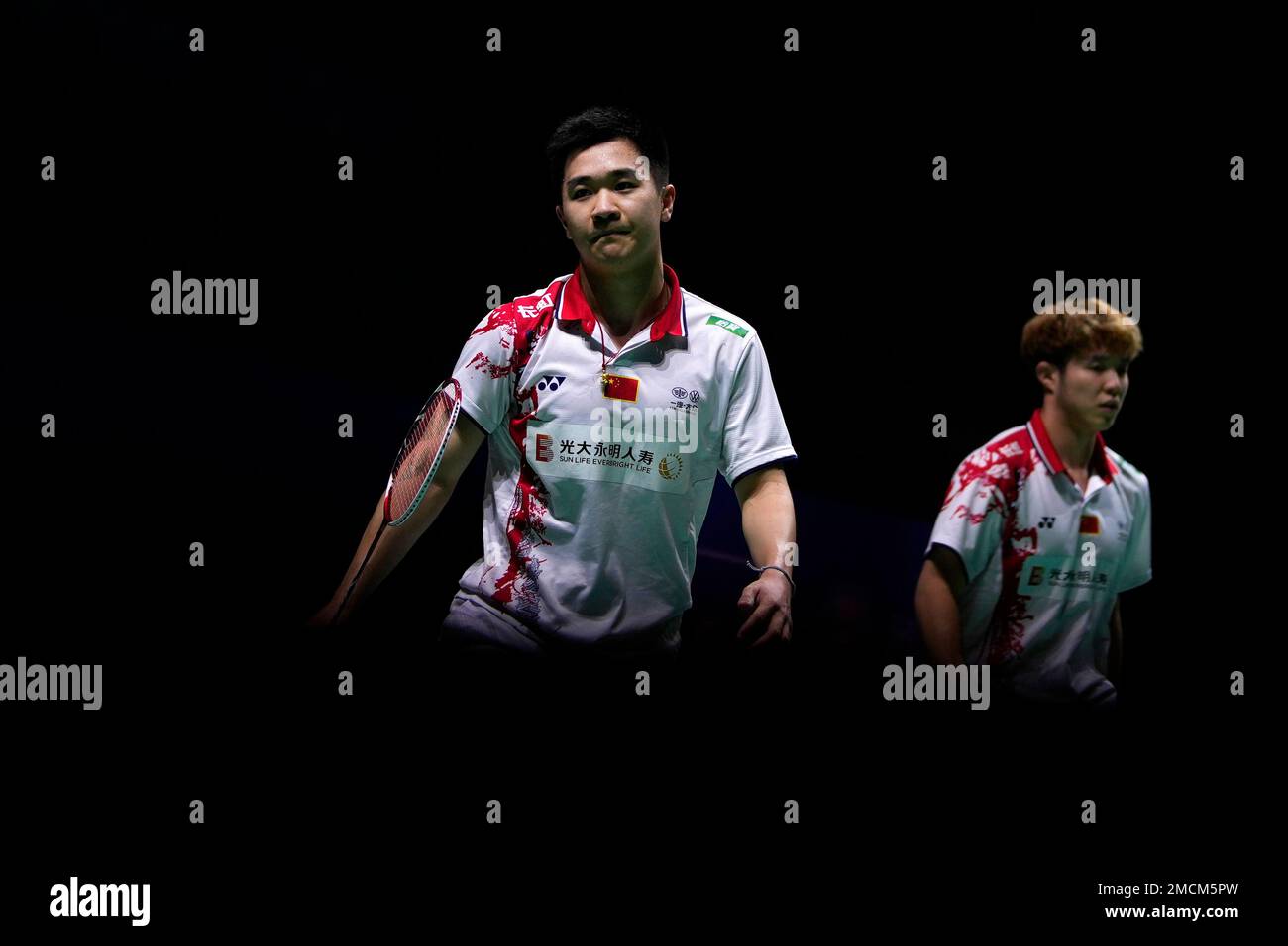 Chinas Tan Qiang and He Ji Ting, right, react during their Mens badminton doubles match against Englands Callum Hemming and Steven Stallwood at the BWF World Championships in Huelva, Spain, Wednesday, Dec.