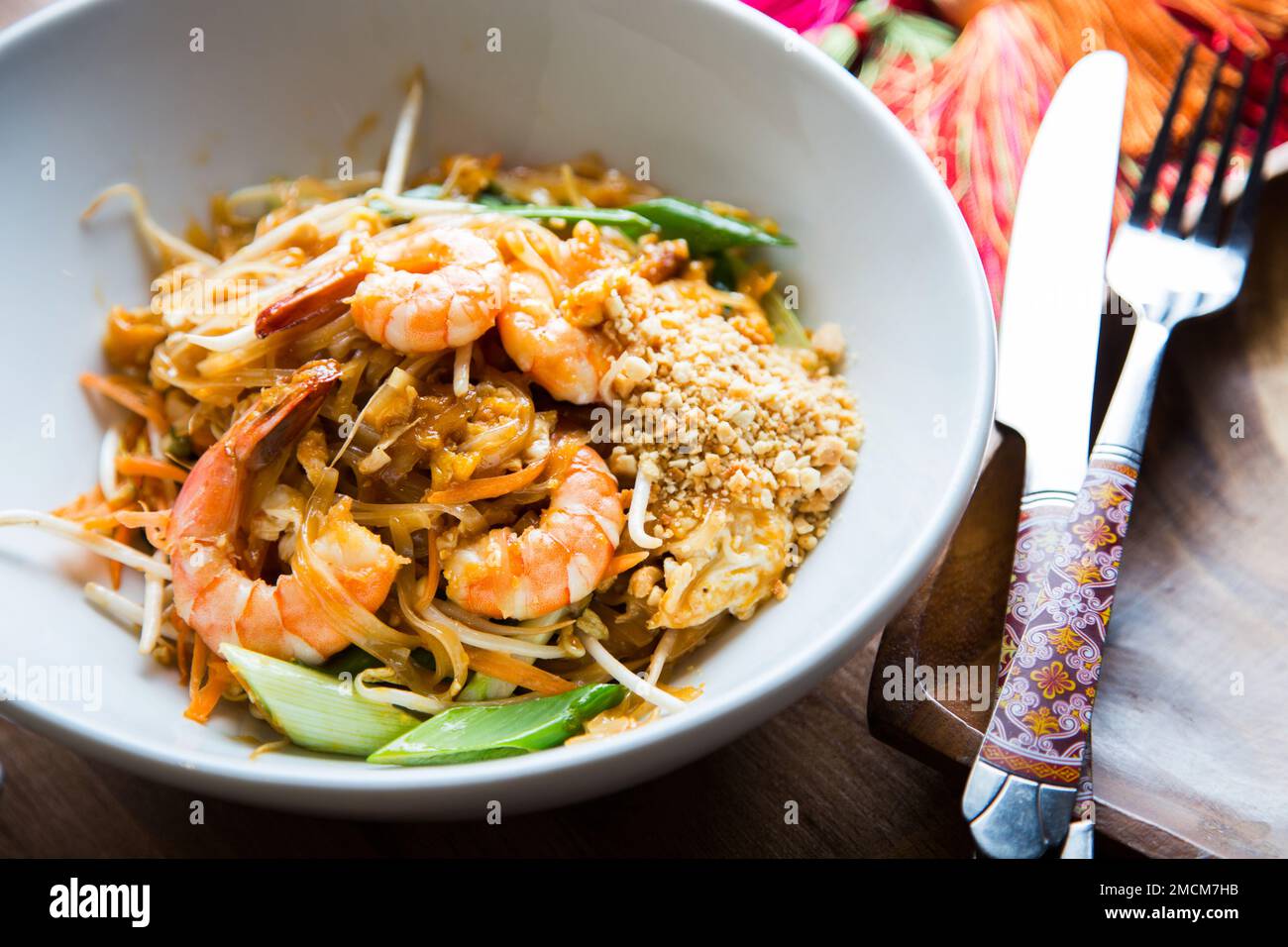 Pad thai, pad thai or pad thai, is a stir-fried rice noodle dish often served as street food in Thailand as part of the country's cuisine. Stock Photo
