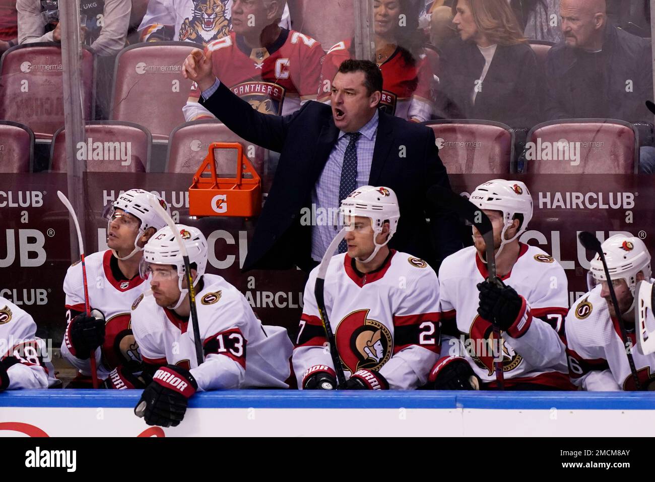Ottawa Senators head coach D.J. Smith stands behind his bench during the  third period of an NHL hockey game against the Pittsburgh Penguins in  Pittsburgh, Thursday, Jan. 20, 2022. The Penguins won