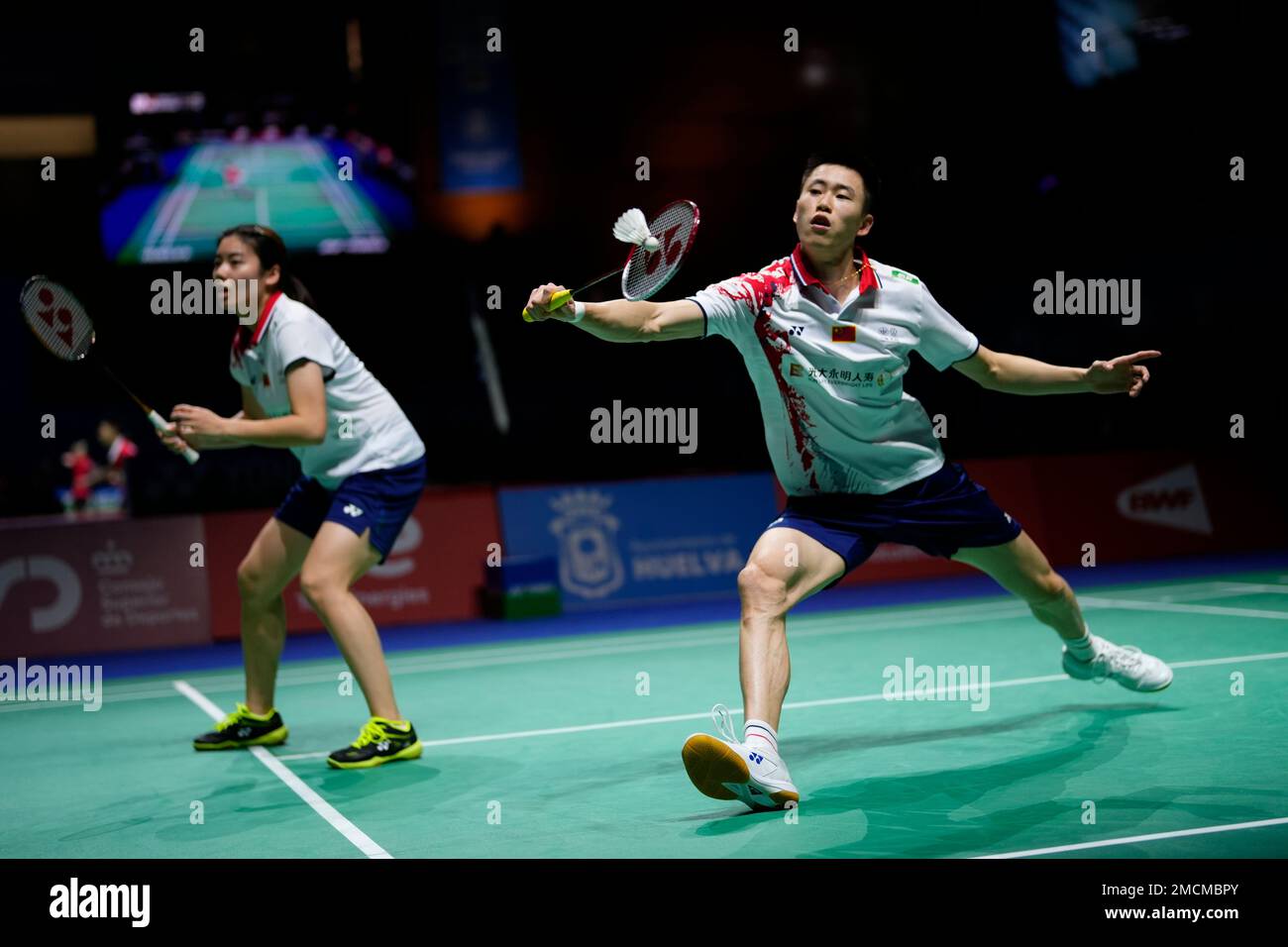 Ou Xuan Yi, right and and Feng Xue Ying of China play against Rodion Alimov  and Alina Davletova of the Russian Federation during their mixed badminton  doubles match at the BWF World
