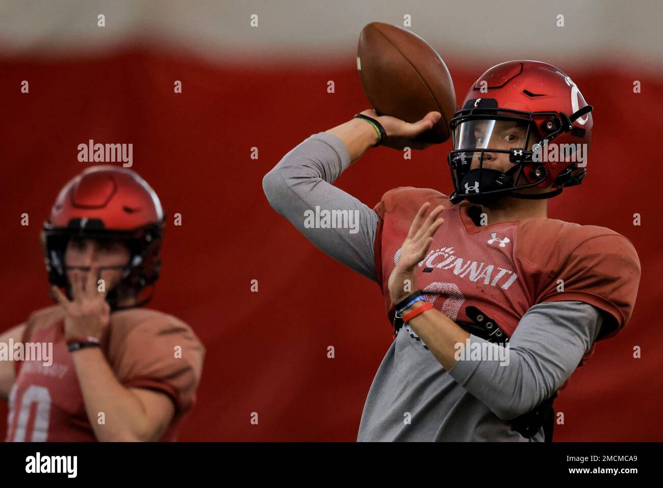 Cincinnati quarterback Desmond Ridder throws a pass during the NCAA