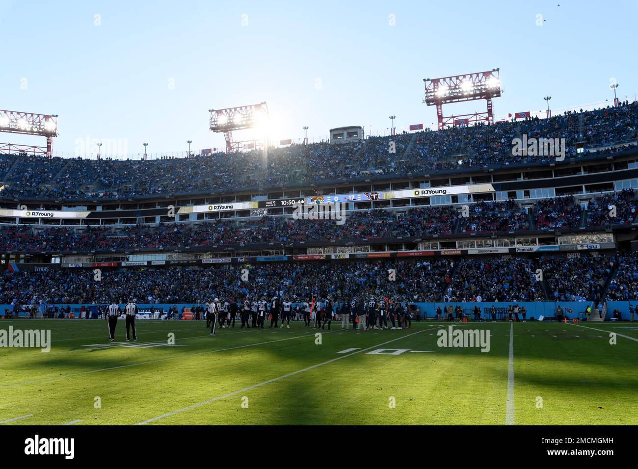 the sun sets behind Nissan Stadium during an NFL football game between the  Tennessee Titans and the Jacksonville Jaguars on Sunday, December 12, 2021,  in Nashville, Tenn. (AP Photo/John Amis Stock Photo 