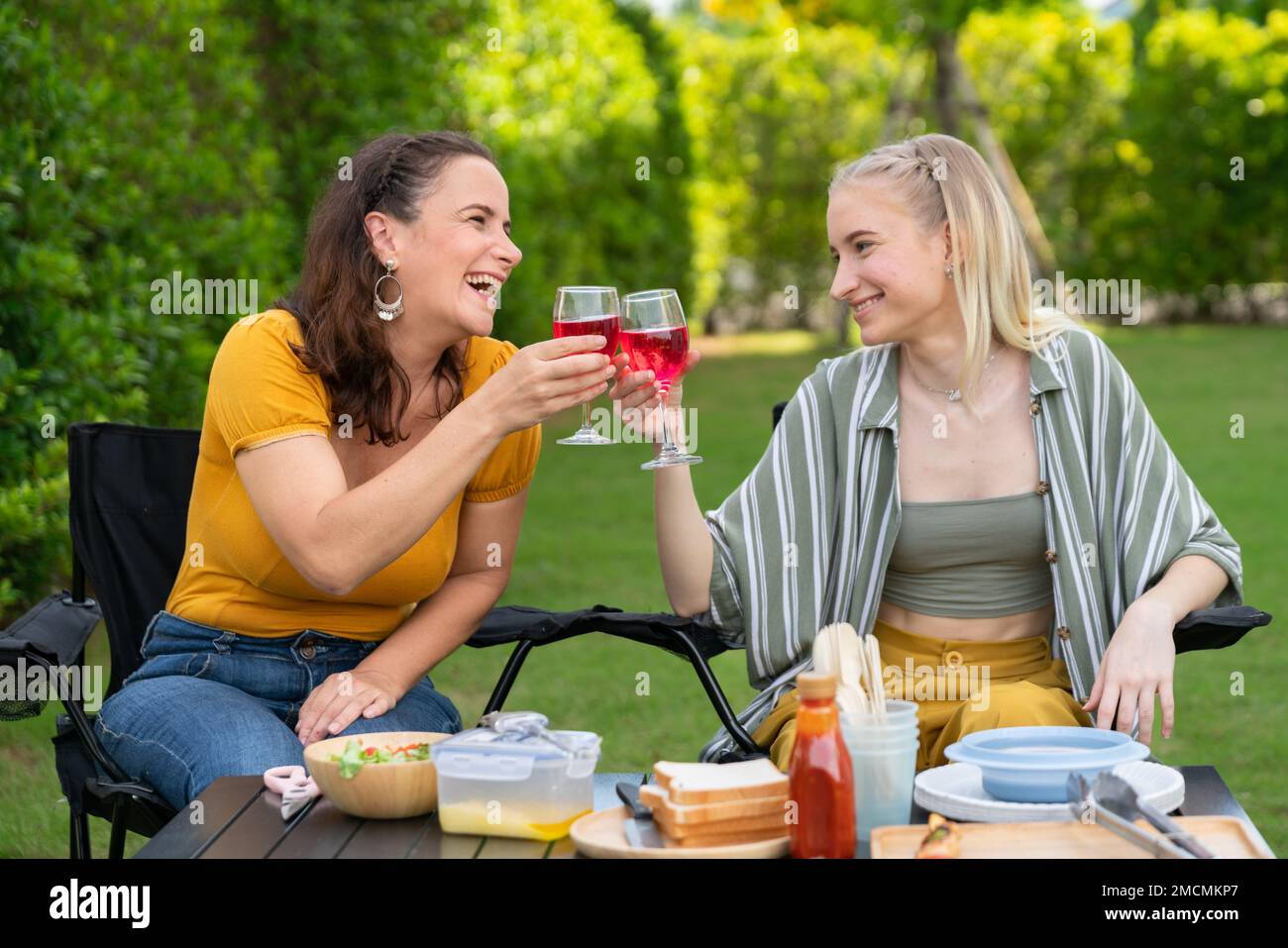 Happy family having barbecue, bbq, party with red wine in outdoor