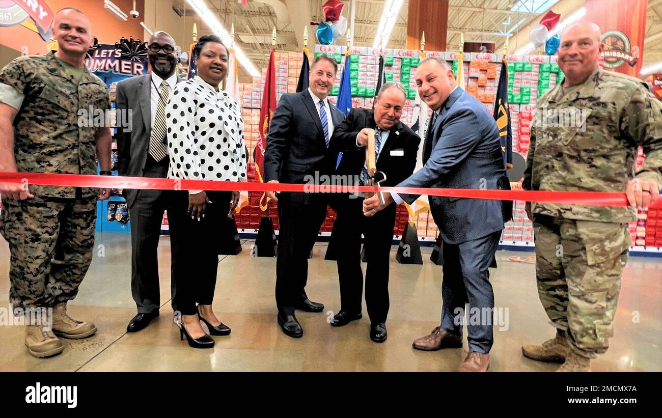 From left, participants of the ribbon cutting: Marine Sgt. Maj. Michael Saucedo, DeCA senior enlisted adviser; Willie Watkins, DeCA chief of eBusiness; Dr. Theon Danet, executive director of DeCA’s IT Group; Bill Moore, DeCA Director and CEO; William Roger, Fort Belvoir store director; Gilbert Cisneros, Under Secretary of Defense for Personnel and Readiness; and Army Command Sgt. Maj. Gregory Kleinholz, Fort Belvoir Garrison command sergeant major. (DeCA photo: Tony Brazier) Stock Photo