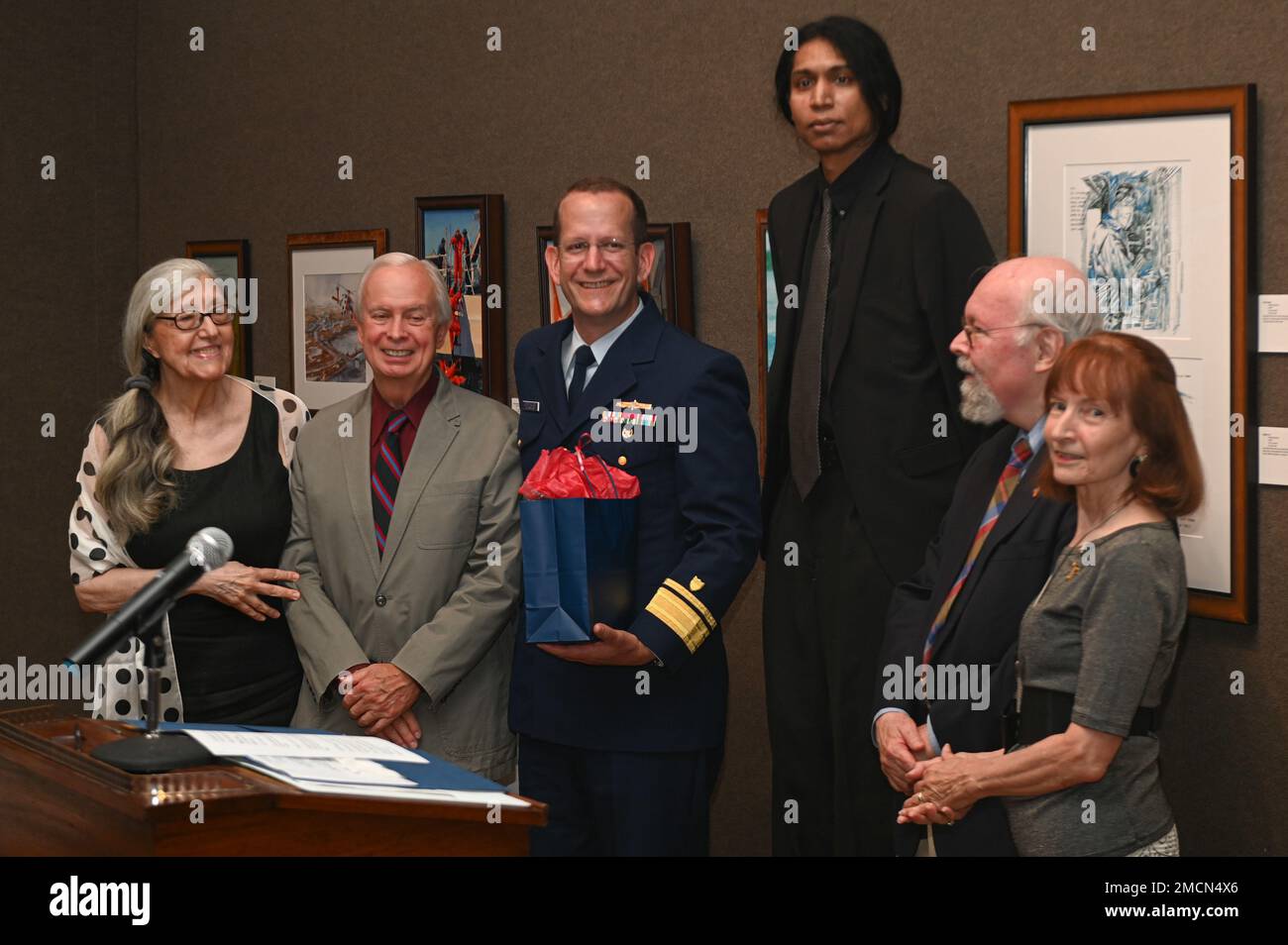 U.S. Coast Guard District 1 Commander Rear Admiral John Mauger accepts