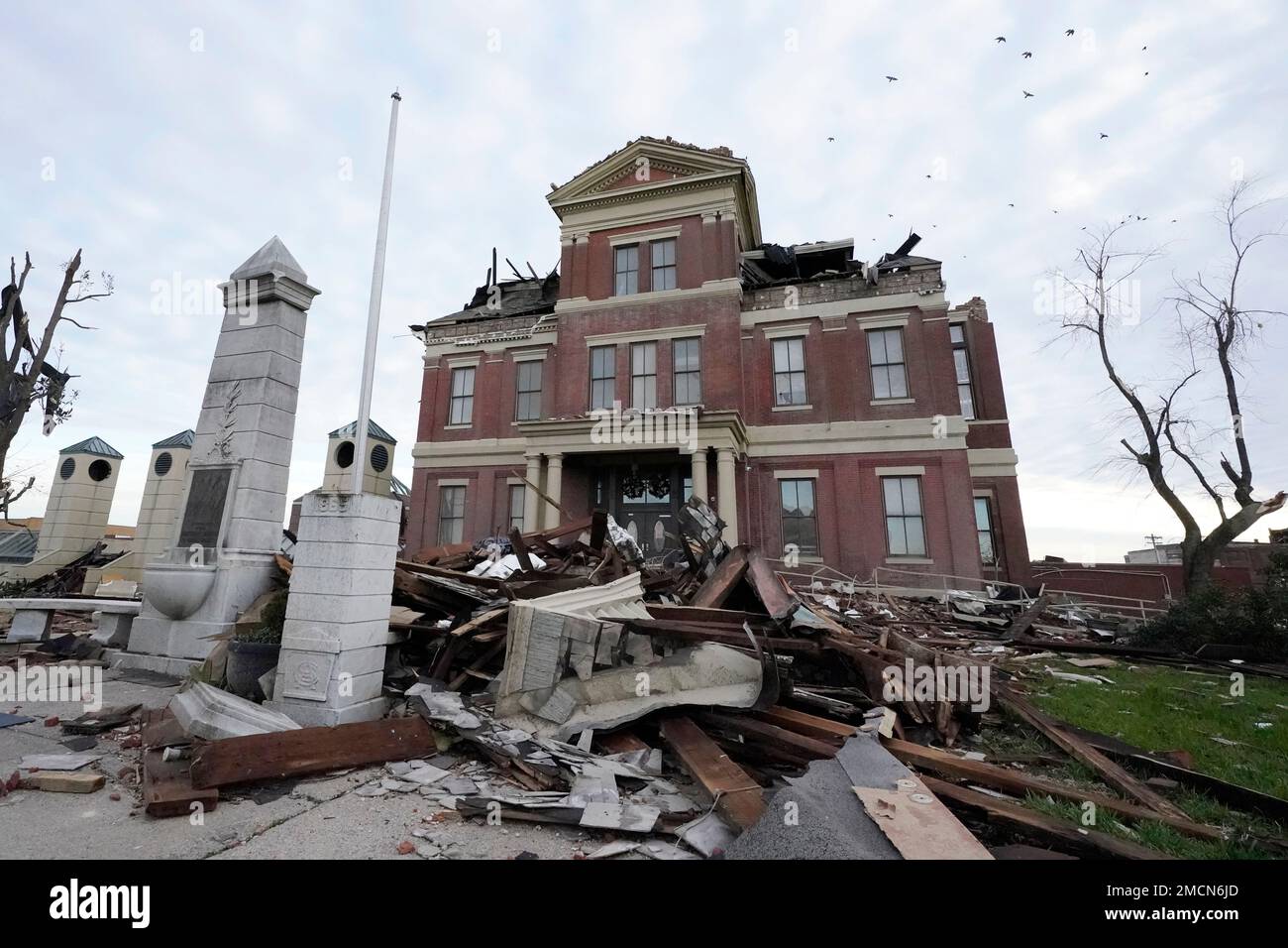 Rubble surrounds the damaged Graves County Courthouse Saturday, Dec. 11