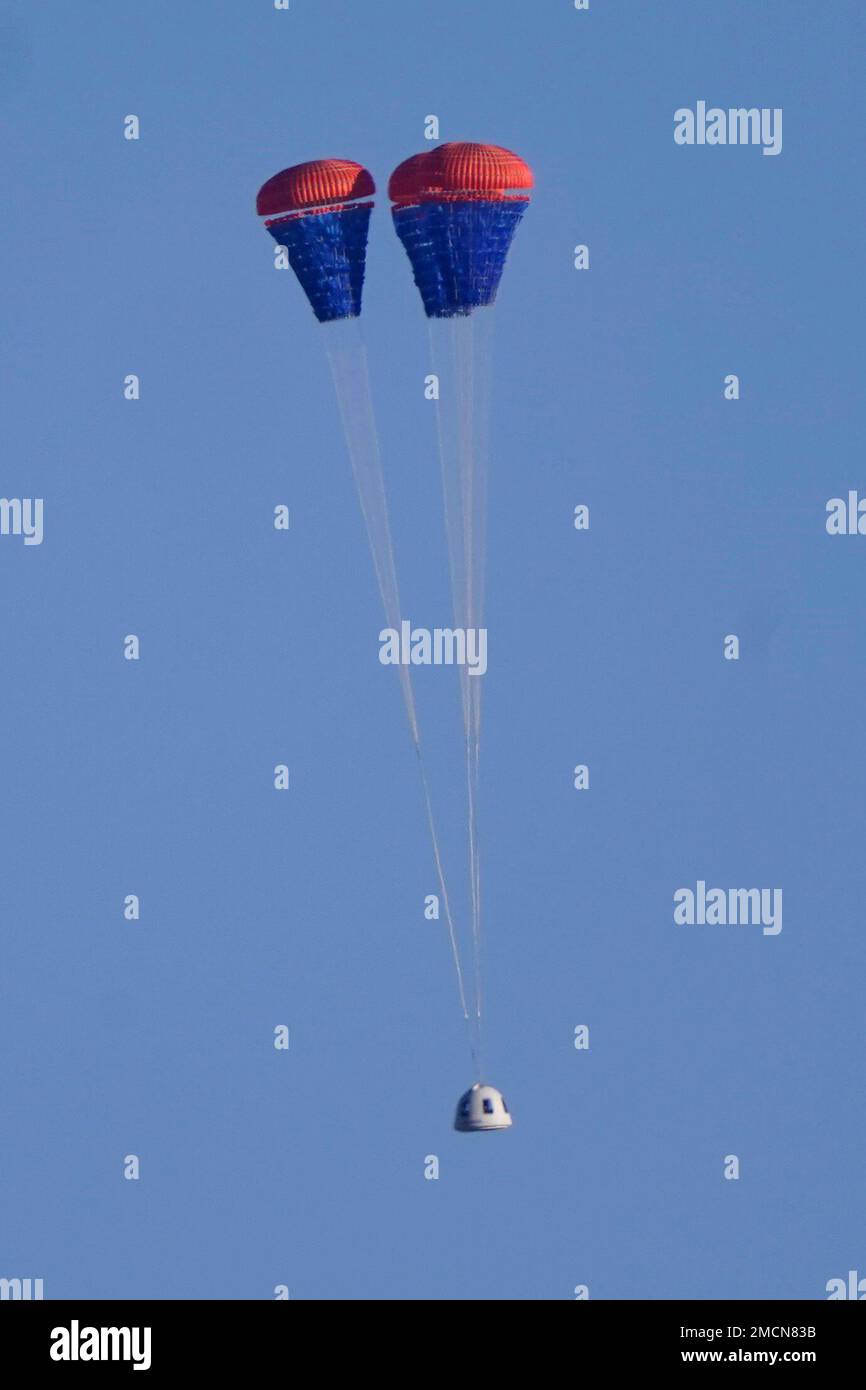 Parachutes deploy to carry the Blue Origin's New Shepard capsule to the