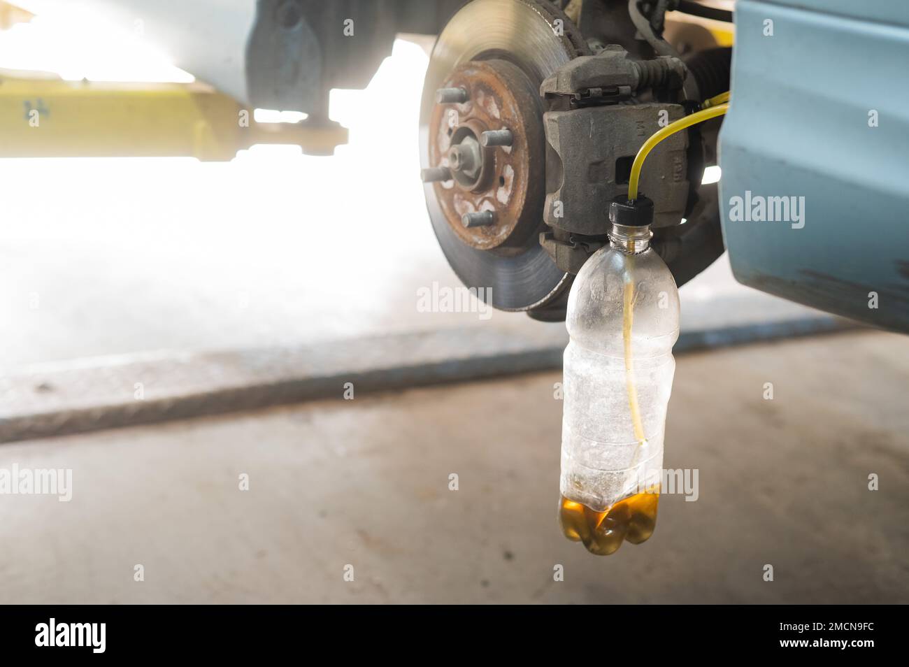 Automatic change of brake fluid in a car service Stock Photo Alamy