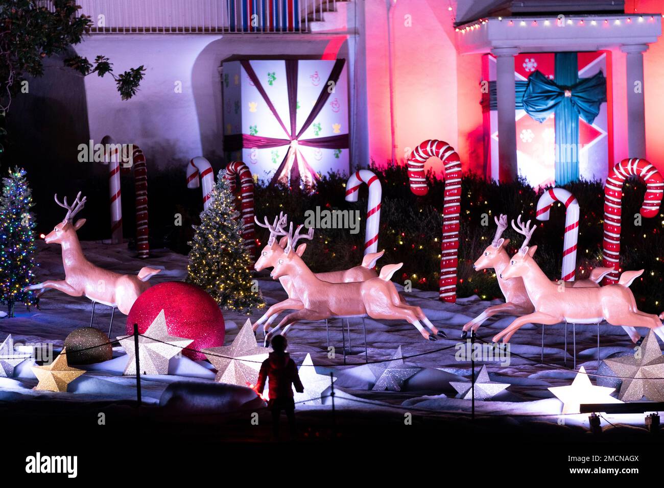 A boy looks at a Christmas display at Holiday Road light show in