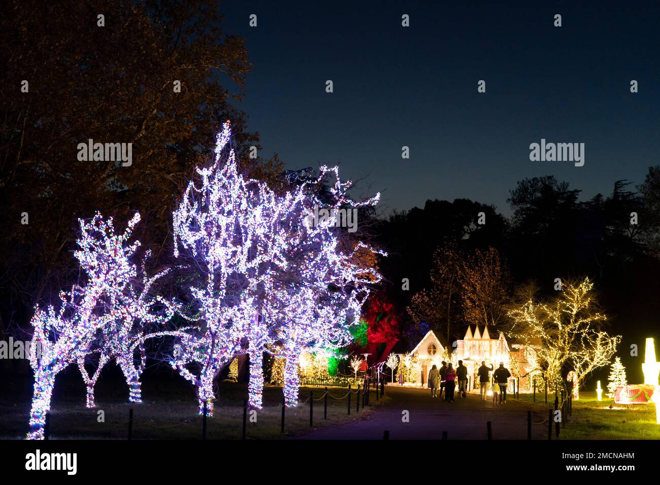 Visitors view Christmas light displays at Holiday Road light show in