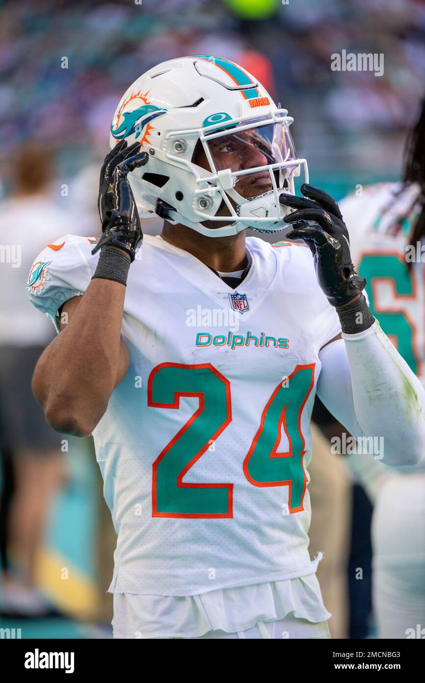 Miami Dolphins cornerback Byron Jones (24) puts on his helmet on the  sidelines during an NFL football game against the New York Giants, Sunday,  Dec. 5, 2021, in Miami Gardens, Fla. (AP