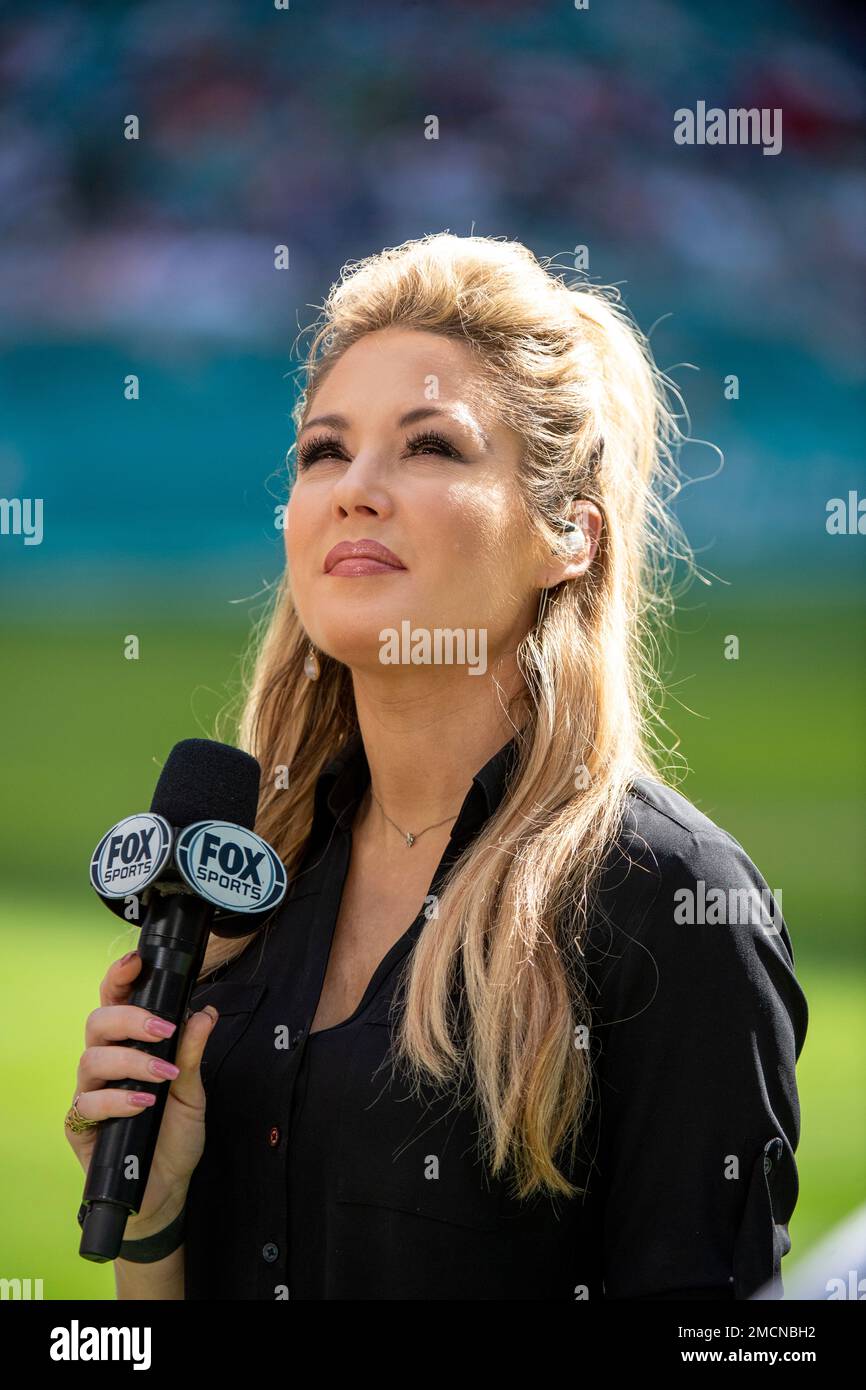 Fox Sports NFL sideline reporter Jen Hale prepares to go on the air before the start of an NFL football game between the New York Giants and the Miami Dolphins, Sunday, Dec.