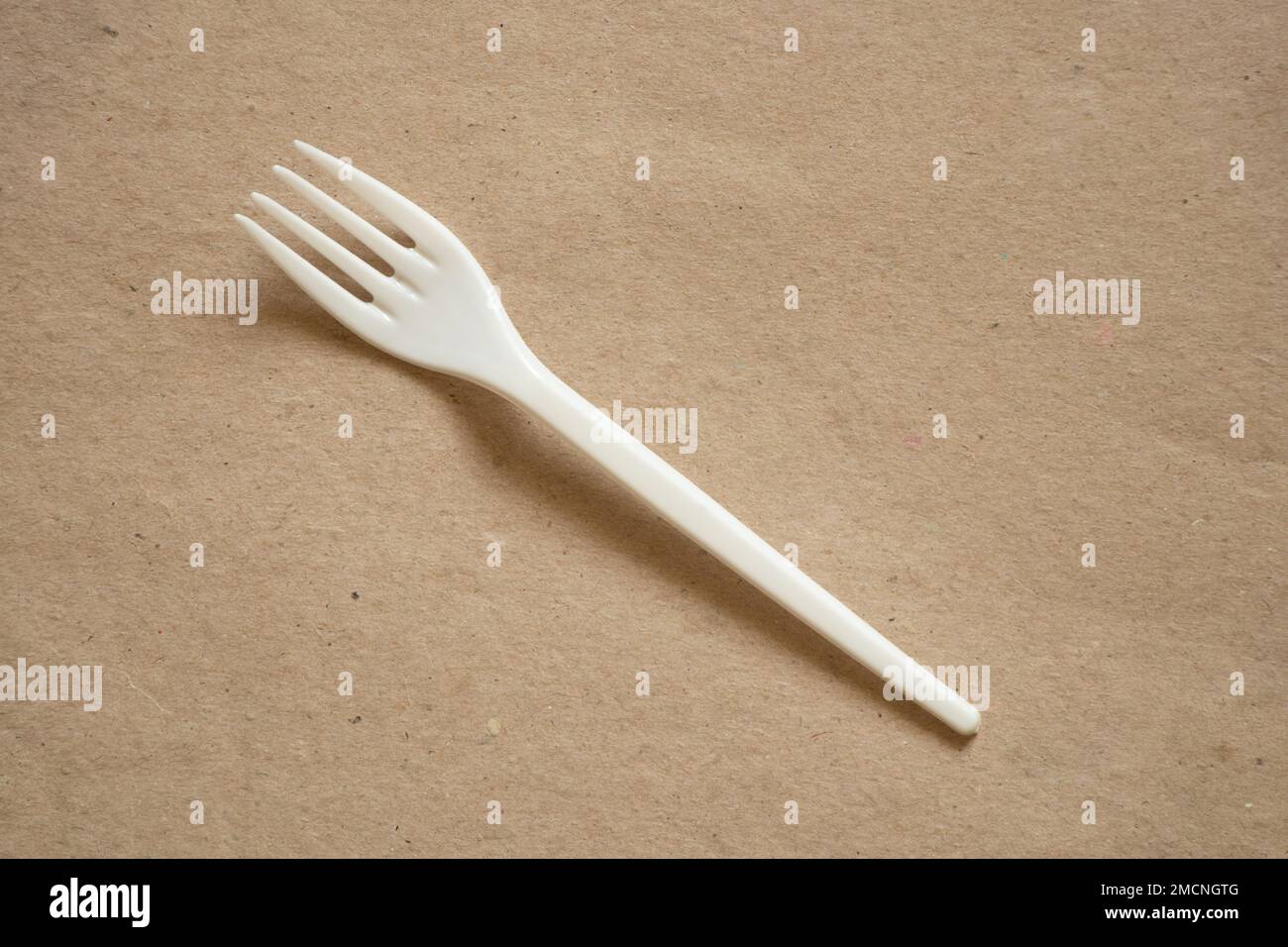 plastic disposable fork on isolated background, disposable tableware and appliances Stock Photo