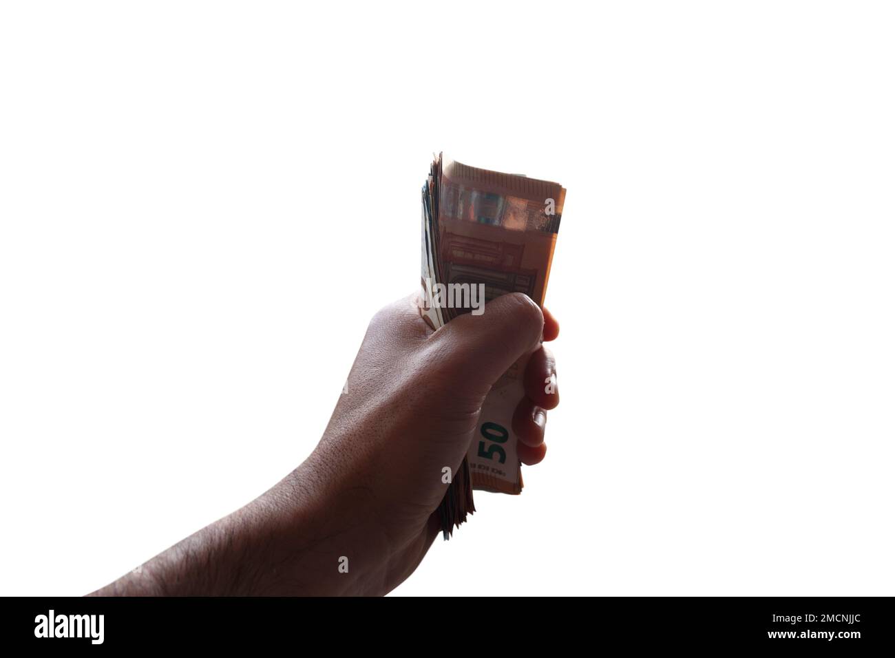 Hand holds some money banknotes, concept of economic wealth and success Stock Photo
