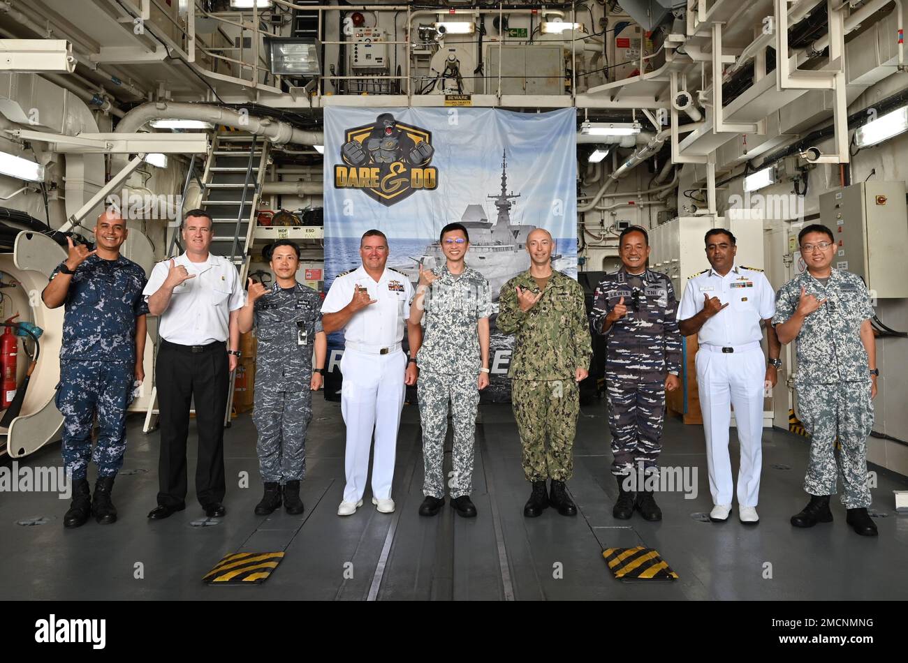 220707-N-SG068-1002-SG PEARL HARBOR (July 7, 2022) CTG176.3 and respective Commanding Officers from TG176.3 pose for a group photo during a luncheon hosted aboard Republic of Singapore Navy guided missile frigate RSS Intrepid (69) during Rim of the Pacific (RIMPAC) 2022. Twenty-six nations, 38 ships, four submarines, more than 170 aircraft and 25,000 personnel are participating in RIMPAC from June 29 to Aug. 4 in and around the Hawaiian Islands and Southern California. The world's largest international maritime exercise, RIMPAC provides a unique training opportunity while fostering and sustain Stock Photo