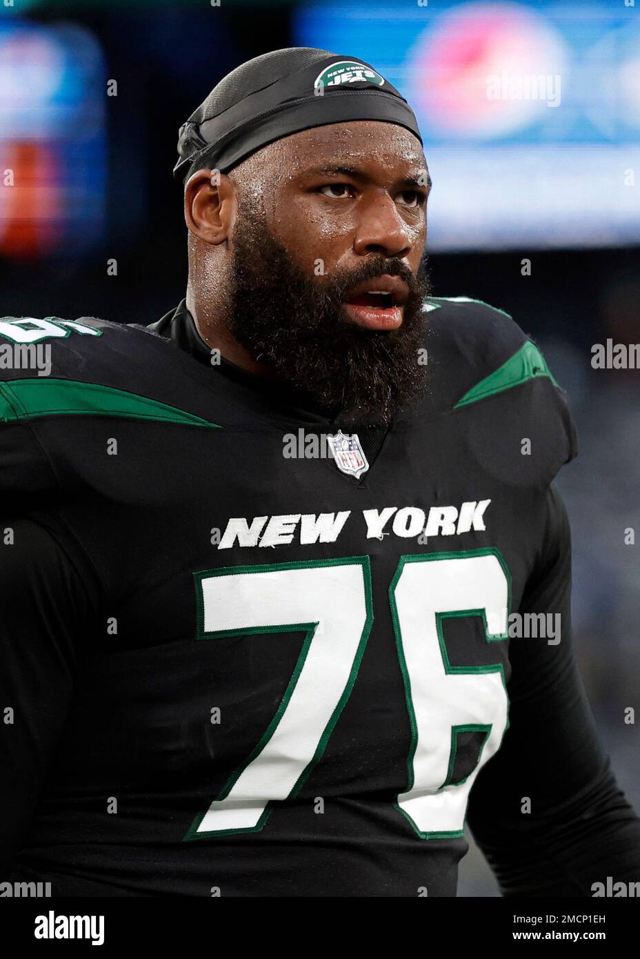 New York Jets offensive tackle George Fant (76) walks off the field after  an NFL football game against the Philadelphia Eagles, Sunday, Dec. 5, 2021,  in East Rutherford, N.J. (AP Photo/Adam Hunger