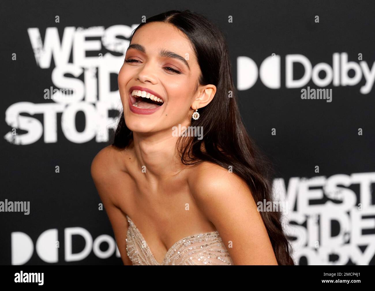 Rachel Zegler, a cast member in "West Side Story," laughs on the red