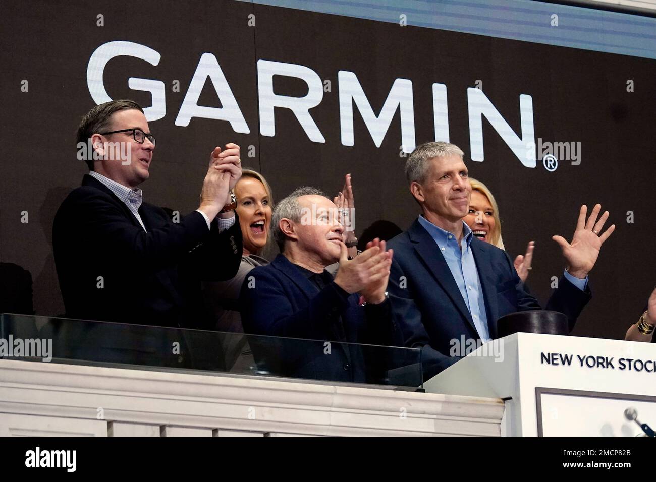 Garmin President & CEO Cliff Pemble, right, rings the New York Stock  Exchange opening bell, Tuesday, Dec. 7, 2021, in celebration of the  company's listing transfer. (AP Photo/Richard Drew Stock Photo - Alamy