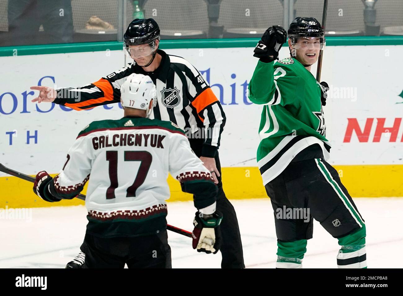 Arizona Coyotes center Alex Galchenyuk (17) looks on as Dallas Stars' Jacob  Peterson (40) celebrates his goal in the third period of an NHL hockey game  in Dallas, Monday, Dec. 6, 2021.