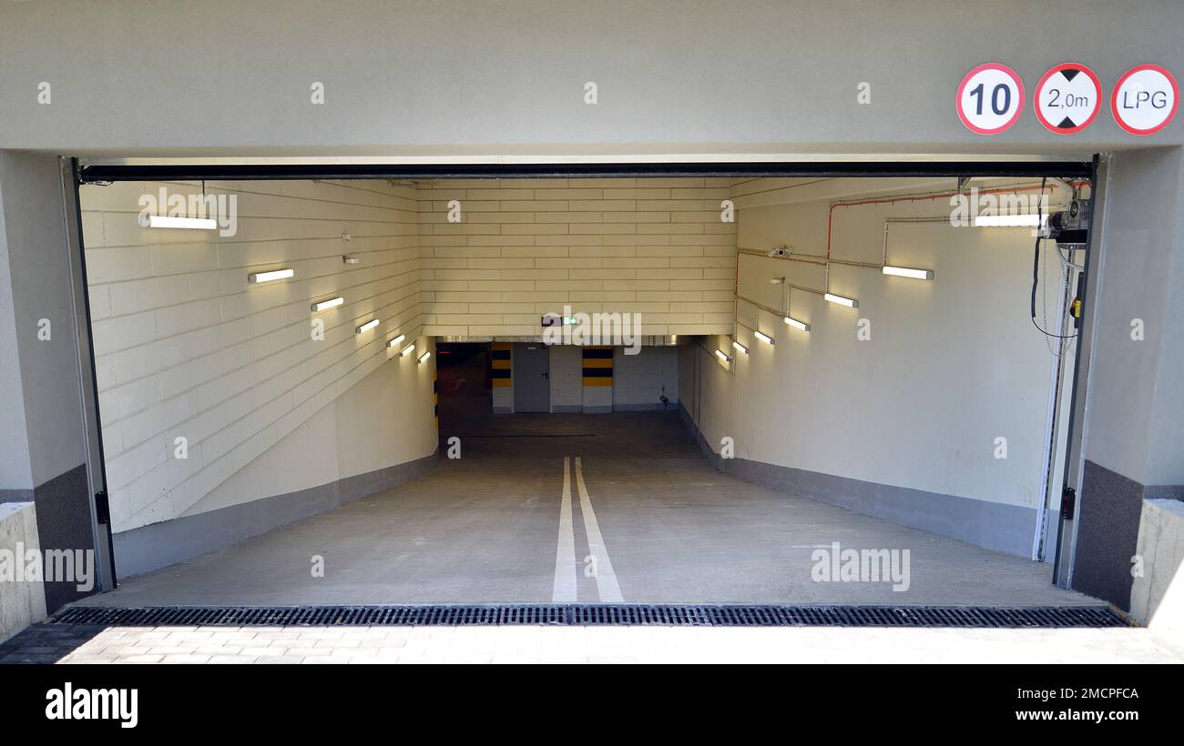 New modern residential apartment house building, garage parking concept