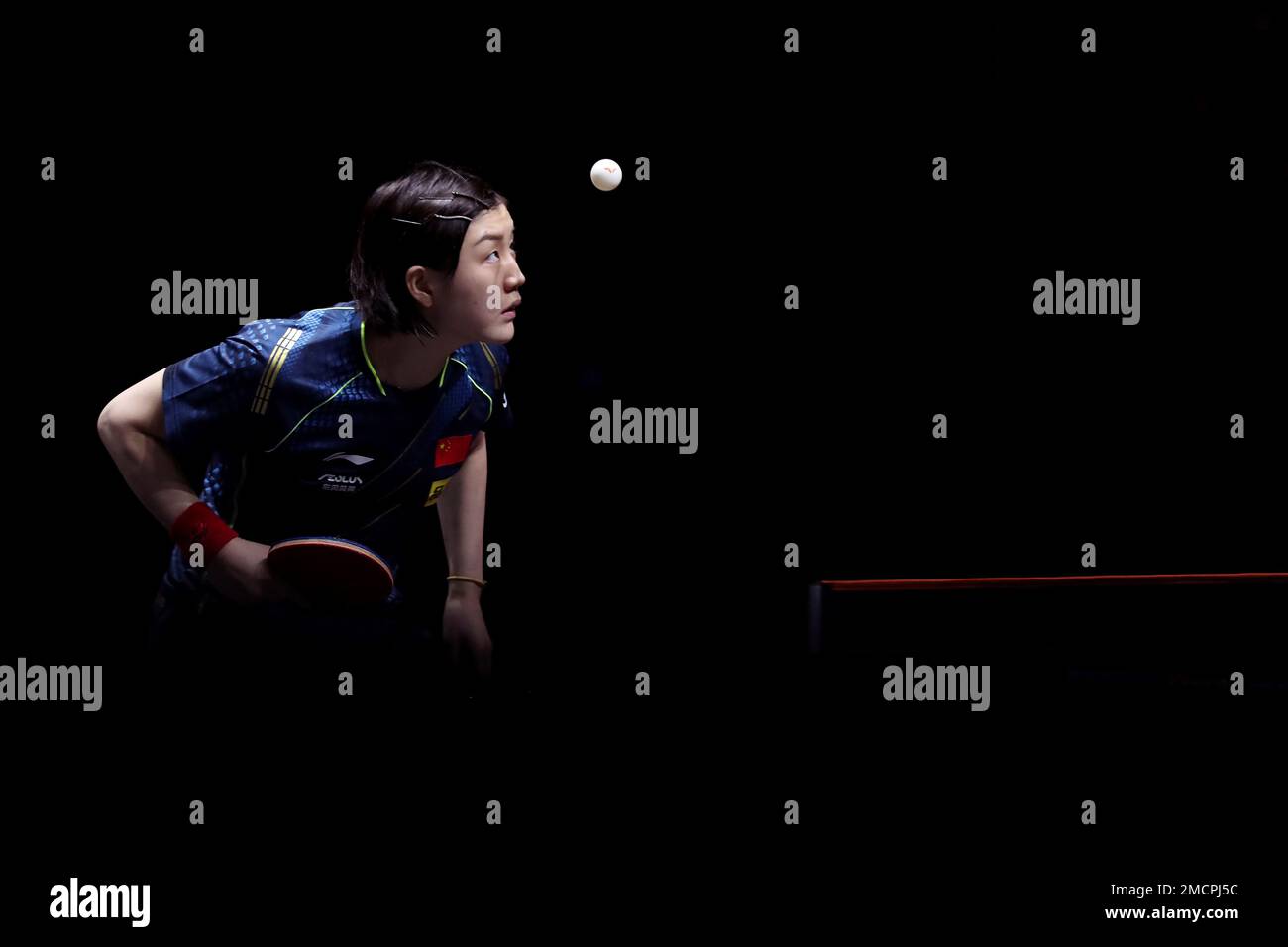 China's Chen Meng returns to China's Wang Yidi during their semifinal
