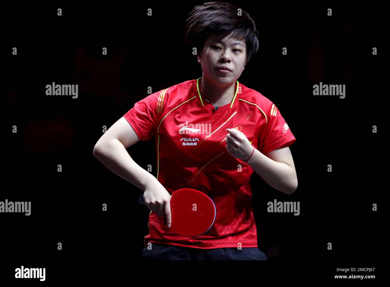 China's Wang Yidi reacts to winning a point against China's Chen Meng