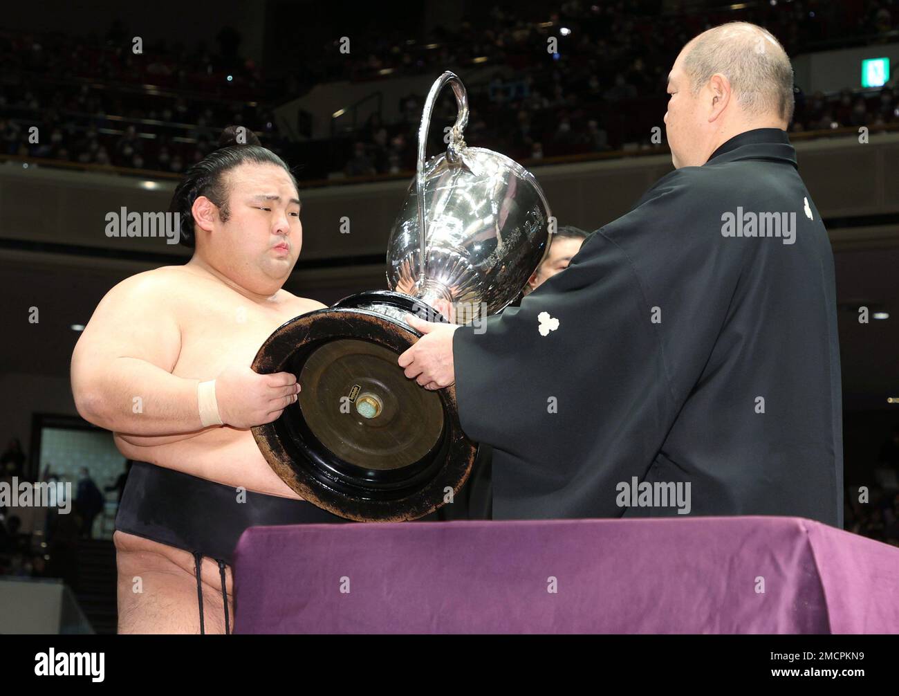 Ozeki Takakeisho (L) receives the Emperor's Cup after winning the New ...