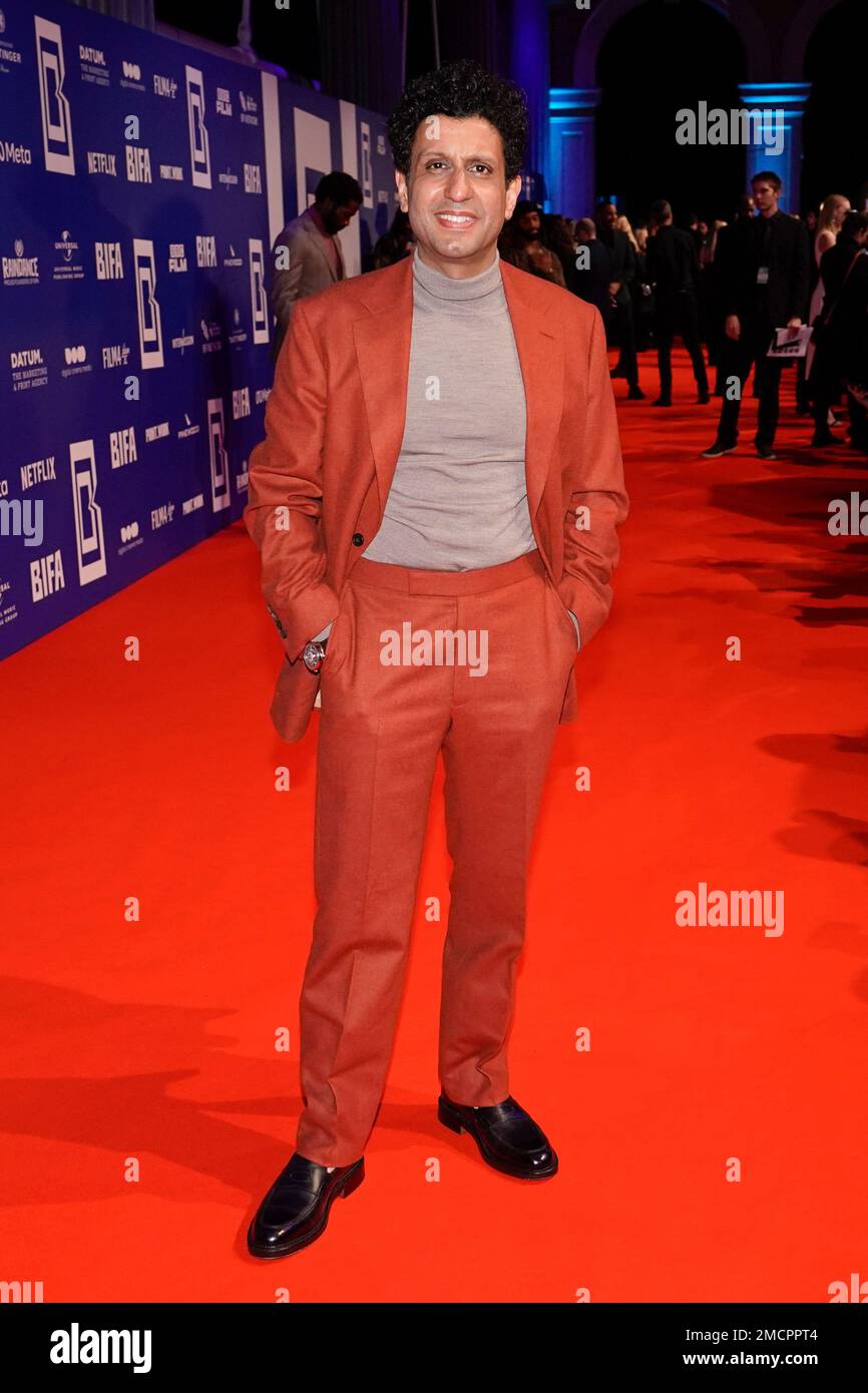 Adeel Akhtar poses for photographers upon arrival at the British