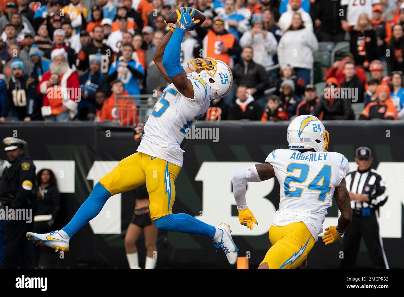 Los Angeles Chargers cornerback Chris Harris (25) chases Carolina Panthers  wide receiver Robby Anderson (11) after an Anderson catch and run during  the second half of an NFL football game Sunday, Sept.