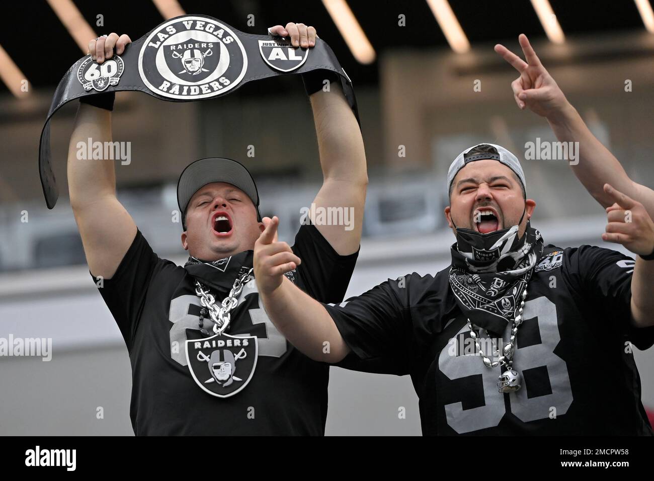 Las Vegas Raiders fans cheer before an NFL football game between the