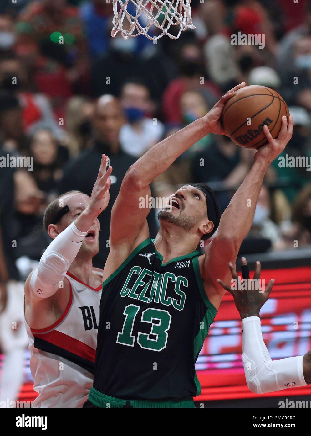 Boston Celtics center Enes Freedom, right, looks to shoot against