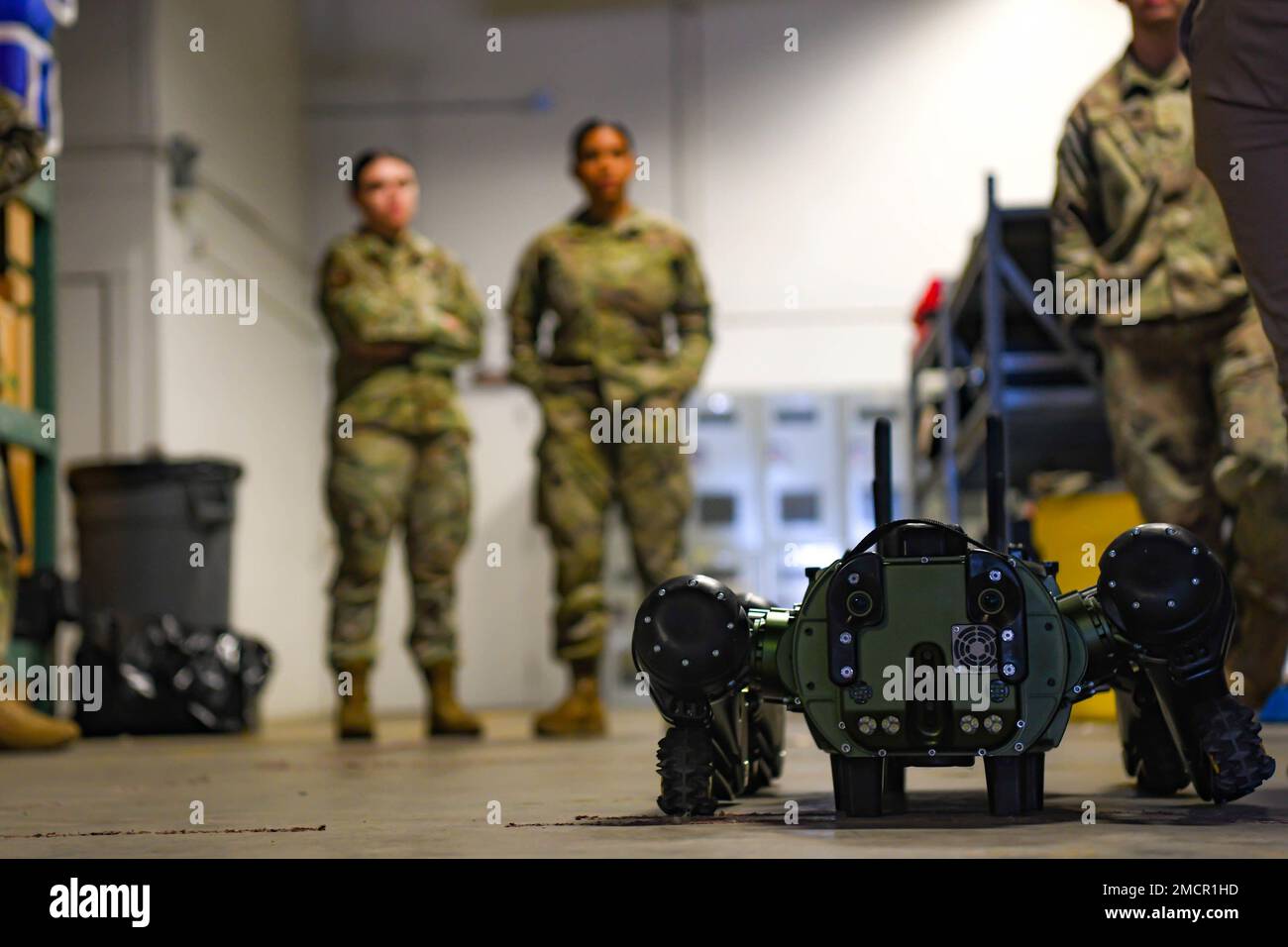 Members of the 5th Civil Engineer Squadron Chemical, Biological, Radiological and Nuclear team (CBRN) train on the new Vision 60 'Robot Dog' on Minot Air Force Base, North Dakota, June 8, 2022. This new technology allows Airmen to react to CBRN threats down range without risking the safety of themselves or others. Stock Photo