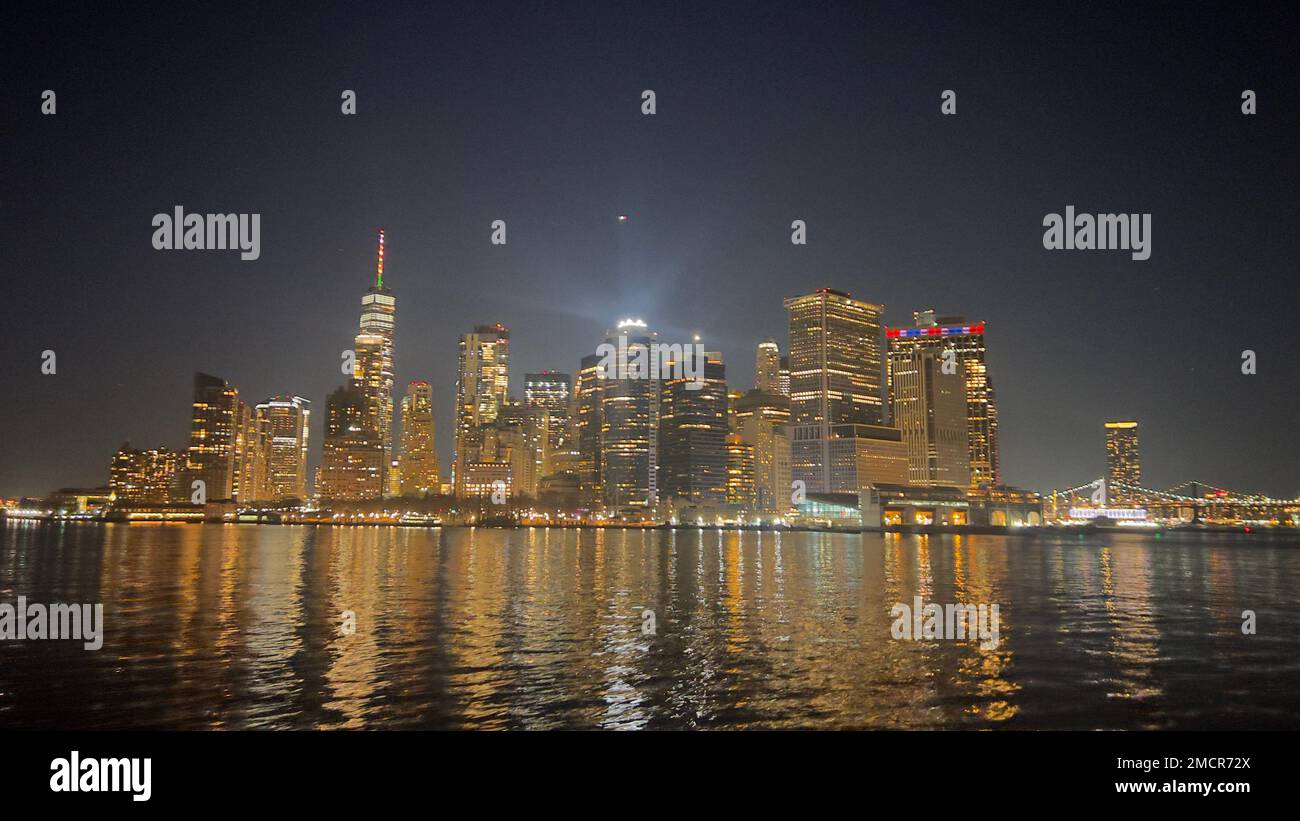 The Lower Manhattan skyline at night from the East River, New York City ...